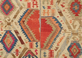 Fetiye Area Kilim, mid-9th century.  Good colors with a soft green and a rich apricot.  Archaic drawing. Corrosion of the browns.  150 x 340 cm. Contact danauger@tribalgardenrugs.com   