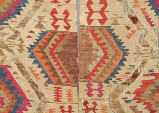 Fetiye Area Kilim, mid-9th century.  Good colors with a soft green and a rich apricot.  Archaic drawing. Corrosion of the browns.  150 x 340 cm. Contact danauger@tribalgardenrugs.com   