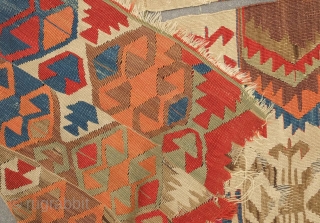 Fetiye Area Kilim, mid-9th century.  Good colors with a soft green and a rich apricot.  Archaic drawing. Corrosion of the browns.  150 x 340 cm. Contact danauger@tribalgardenrugs.com   