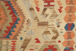 Fetiye Area Kilim, mid-9th century.  Good colors with a soft green and a rich apricot.  Archaic drawing. Corrosion of the browns.  150 x 340 cm. Contact danauger@tribalgardenrugs.com   