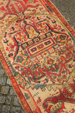 NW Persian rug, dated 1907. Central medallion and large pendant arrangement in a wild drawing. Goats in the field and human-like figures in the central medallion. Unusual. 105 x 227 cm  