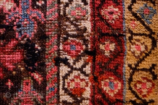 Sauj Bulak Kurdish Rug, Late 19th Century.  All great Sauj natural colors on a rich dark ground.  Safavid derivative floral motifs and Kashmir shawl-like borders.  Lower pile in the  ...