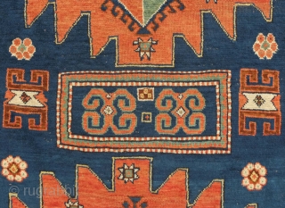 Karachof Kazak rug, 19th century.  Mellower shades in natural dyes.  In good condition with a reconnected tear at the bottom and some slightly lower pile in the medallions.    ...