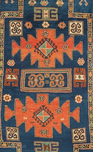 Karachof Kazak rug, 19th century.  Mellower shades in natural dyes.  In good condition with a reconnected tear at the bottom and some slightly lower pile in the medallions.    ...