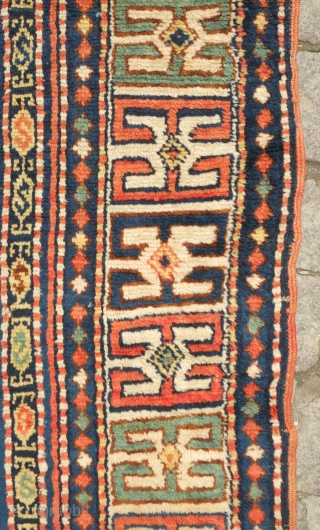 Karachof Kazak rug, 19th century.  Mellower shades in natural dyes.  In good condition with a reconnected tear at the bottom and some slightly lower pile in the medallions.    ...