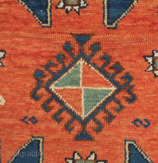 Karachof Kazak rug, 19th century.  Mellower shades in natural dyes.  In good condition with a reconnected tear at the bottom and some slightly lower pile in the medallions.    ...