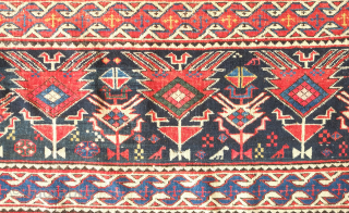 Shirvan rug, 19th century.  Botehs and shrubs of life or shrubbery of a general nature flanked by birds.  The weave is fine.  A section of wear in one of  ...