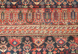 Shirvan rug, 19th century.  Botehs and shrubs of life or shrubbery of a general nature flanked by birds.  The weave is fine.  A section of wear in one of  ...