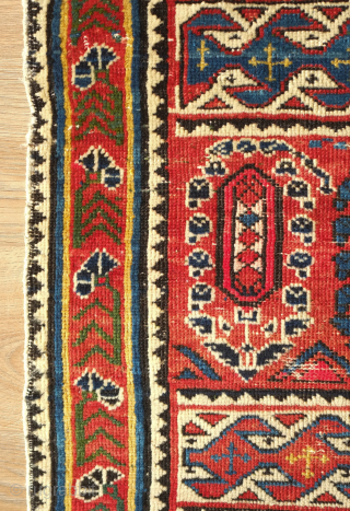 Shirvan rug, 19th century.  Botehs and shrubs of life or shrubbery of a general nature flanked by birds.  The weave is fine.  A section of wear in one of  ...