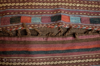 Kohistani saddle bag from Badghis area of Afghanistan.  Late 19th Century.  This has a beautiful striped back in natural colors.  Colors are all good.  Some of these bags  ...