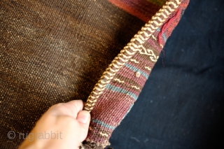 Kohistani saddle bag from Badghis area of Afghanistan.  Late 19th Century.  This has a beautiful striped back in natural colors.  Colors are all good.  Some of these bags  ...