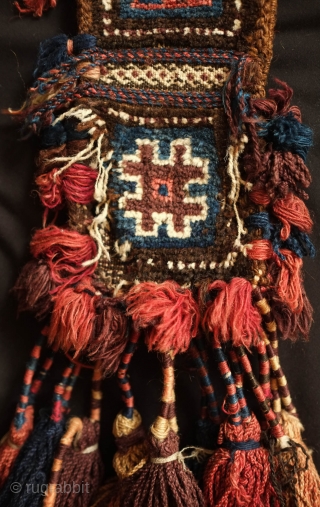 Baluch Camel neck colar. 19th Century.  Almost all good colors with some fading in the red tassel and in some of the white pile.  Overall good condition with wear in  ...