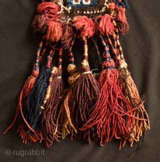 Baluch Camel neck colar. 19th Century.  Almost all good colors with some fading in the red tassel and in some of the white pile.  Overall good condition with wear in  ...