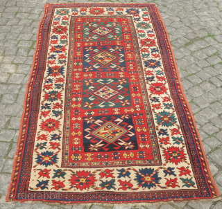 Kazak rug, 3rd to 4th quarter of the 19th century.  Hooked medallions in squares and a crab leaf border.  Good pile and general condition. 110 x 224 cm   