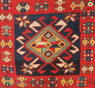 Kazak rug, 3rd to 4th quarter of the 19th century.  Hooked medallions in squares and a crab leaf border.  Good pile and general condition. 110 x 224 cm   