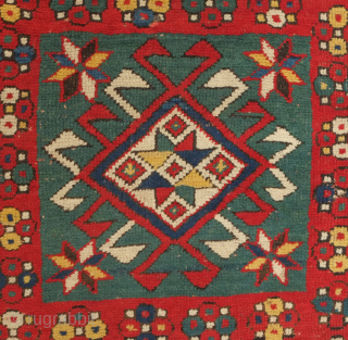 Kazak rug, 3rd to 4th quarter of the 19th century.  Hooked medallions in squares and a crab leaf border.  Good pile and general condition. 110 x 224 cm   