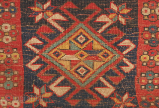 Kazak rug, 3rd to 4th quarter of the 19th century.  Hooked medallions in squares and a crab leaf border.  Good pile and general condition. 110 x 224 cm   