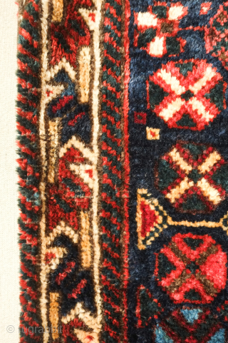 Lori saddle bag, one side, 19th century. Lustrous wool. Excellent drawing in the central medallion which floats on the field and other motifs. Dark duck head green in the arms the medallion.  ...