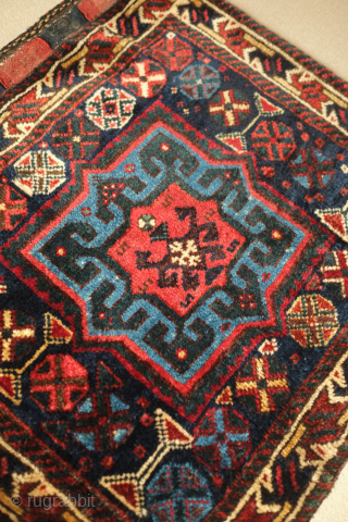 Lori saddle bag, one side, 19th century. Lustrous wool. Excellent drawing in the central medallion which floats on the field and other motifs. Dark duck head green in the arms the medallion.  ...