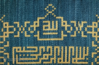 Damascene Silk Sura Panel, late 19th Century.  It is the Surat el Ikhlass (Loyalty) and reads: 

Kul huwa allahu ahad
Allahu el samad
Lam yalid wa lam yulad
Wa lam yakun lahu kufuwan ahad

Translation:

Say  ...