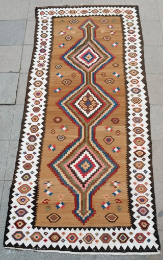 South Azerbaijan Kilim, Late 19th Century.  Camel wool field surrounded by white border with striking colorful medallions.  Excellent colors.  It has a couple of stains, one on the upper  ...