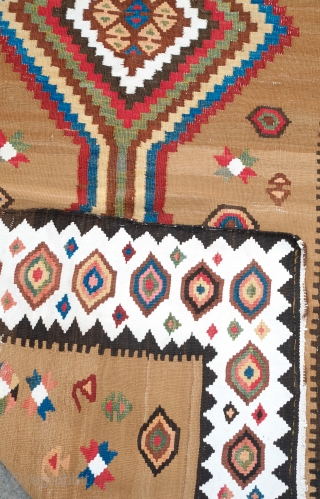 South Azerbaijan Kilim, Late 19th Century.  Camel wool field surrounded by white border with striking colorful medallions.  Excellent colors.  It has a couple of stains, one on the upper  ...