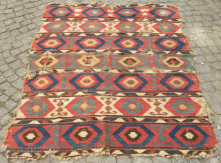 Borchalu kilim, mid-19th century or so.  Exquisite large bullseye hexagons in wonderful purple, yellow, blues and reds.  Distressed but still a beauty. 155 x 204 cm     