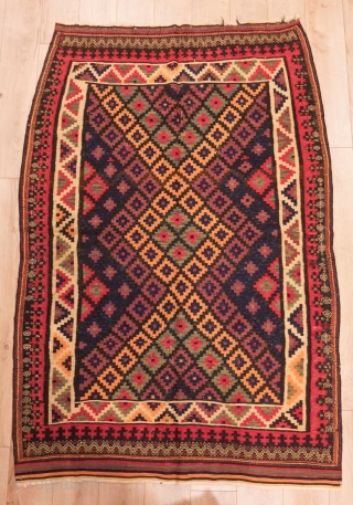 Veramin Afshar Kilim, Late 19th century. Good array of colors including a deep purple.   
 141 x 212 cm            