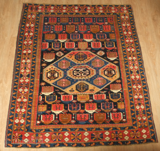 Kuba rug, late 19th/early 20th century.  It has a dynamic central medallion and abstract animal motifs populating the field. Its weave is fine and is in excellent condition. 130 x 164  ...