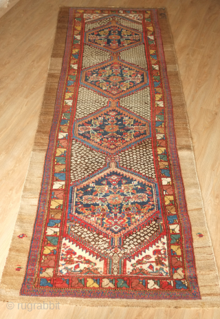 Hamadan long rug, 1904 inscription. Excellent colors, camel wool along the sides, very soft wool overall, and an intriguing abstract floral border.  121 x 313 cm. Contact danauger@tribalgardenrugs.com    