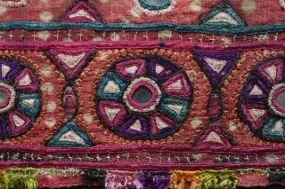 Kutch Embroidery hanging, 3rd-4th Quarter of the 19th century. The ground is in handspun cotton in a soft red with tie die patterning and wonderful silk embroidery.  It seems to have  ...