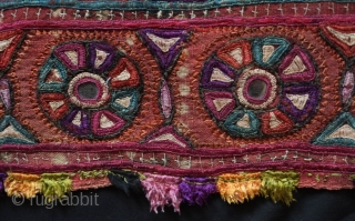 Kutch Embroidery hanging, 3rd-4th Quarter of the 19th century. The ground is in handspun cotton in a soft red with tie die patterning and wonderful silk embroidery.  It seems to have  ...