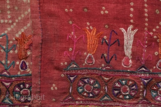 Kutch Embroidery hanging, 3rd-4th Quarter of the 19th century. The ground is in handspun cotton in a soft red with tie die patterning and wonderful silk embroidery.  It seems to have  ...