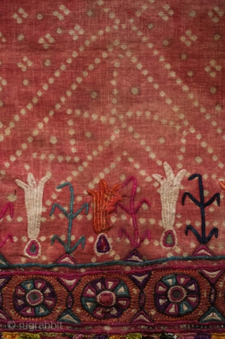 Kutch Embroidery hanging, 3rd-4th Quarter of the 19th century. The ground is in handspun cotton in a soft red with tie die patterning and wonderful silk embroidery.  It seems to have  ...