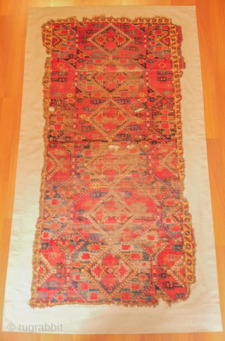 Beshir rug, 19th century. Atypical design scheme.  Worn but design visible.  Mounted on linen and ready for display.  107 x 209 cm, linen 130 x 237 cm. Contact danauger@tribalgardenrugs.com 