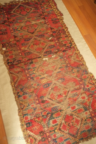 Beshir rug, 19th century. Atypical design scheme.  Worn but design visible.  Mounted on linen and ready for display.  107 x 209 cm, linen 130 x 237 cm. Contact danauger@tribalgardenrugs.com 