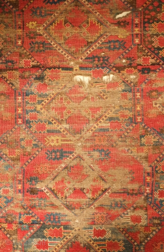 Beshir rug, 19th century. Atypical design scheme.  Worn but design visible.  Mounted on linen and ready for display.  107 x 209 cm, linen 130 x 237 cm. Contact danauger@tribalgardenrugs.com 