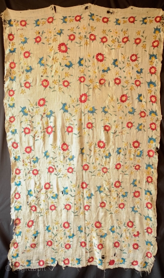 Ottoman Embroidery, 18th Century. Overall floral motif in strong, vibrant colors in silk on linen. The maroon-brownish silk has been coroded in the stems and border outlines. This is a complete suzani.  ...