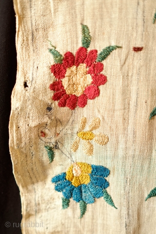 Ottoman Embroidery, 18th Century. Overall floral motif in strong, vibrant colors in silk on linen. The maroon-brownish silk has been coroded in the stems and border outlines. This is a complete suzani.  ...