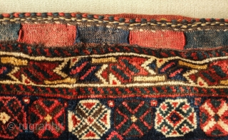 Shiraz saddle bag, one side, 19th century.  Lustrous wool.  Excellent drawing in the central medallion which floats on the field and other motifs.  Dark duck head green in the  ...