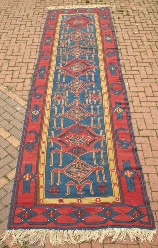 Avar Kilim, 19th century.  Evocative zoomorphic pendants framed by a simple border.  140 x 482 cm. Contact danauger@tribalgardenrugs.com             