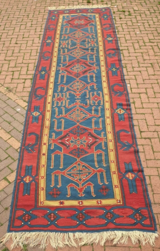 Avar Kilim, 19th century.  Evocative zoomorphic pendants framed by a simple border.  140 x 482 cm. Contact danauger@tribalgardenrugs.com             