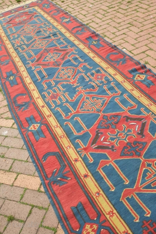 Avar Kilim, 19th century.  Evocative zoomorphic pendants framed by a simple border.  140 x 482 cm. Contact danauger@tribalgardenrugs.com             