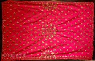 Phulkari, Late 19th century. Wonderful rich red ground with orange, green and white silk. In all around good shape with a bit of tear in the top left corner.  148 x  ...