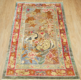 Ningxia Silk and Metallic thread rug, 3rd quarter of the 19th century.  Luxuriant color combination.  Depiction of a crane, symbolizing longevity, and a phoenix, the embodiment of fortuitous omens. Note  ...