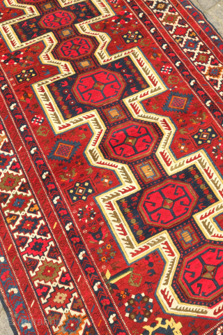 Kuba pole medallion rug, 19th century.  Fantastically drawn kochaks in the pole medallion.  It boasts a myriad of motifs such as Harshangs, swastikas, birds, Talish rosettes, tulips, compartments, and others.  ...