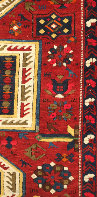 Kuba pole medallion rug, 19th century.  Fantastically drawn kochaks in the pole medallion.  It boasts a myriad of motifs such as Harshangs, swastikas, birds, Talish rosettes, tulips, compartments, and others.  ...