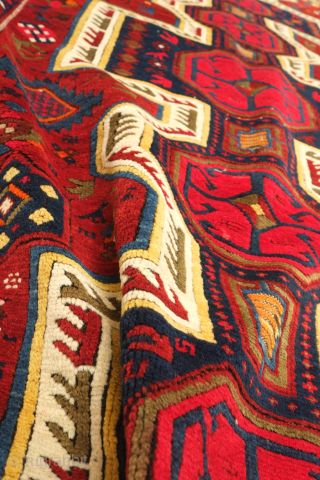 Kuba pole medallion rug, 19th century.  Fantastically drawn kochaks in the pole medallion.  It boasts a myriad of motifs such as Harshangs, swastikas, birds, Talish rosettes, tulips, compartments, and others.  ...