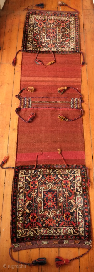 Khamseh Khorjin, late 19th century. A fantastic bag with almost all tassels in tact. Colorful and rich extra wrapping along the center. The wool is lustrous. In about as perfect condition as  ...