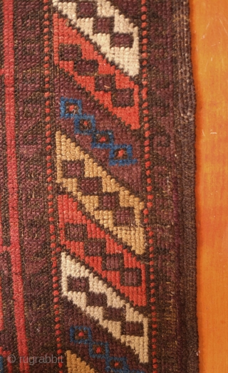 Aimaq "Baluch" Rug, Late 19th Century.  Dokhtar-e Ghazi variant design.  The repeat floral motif is also similar to those that appear on Seljuk rugs.  The repeated pattern is broken  ...